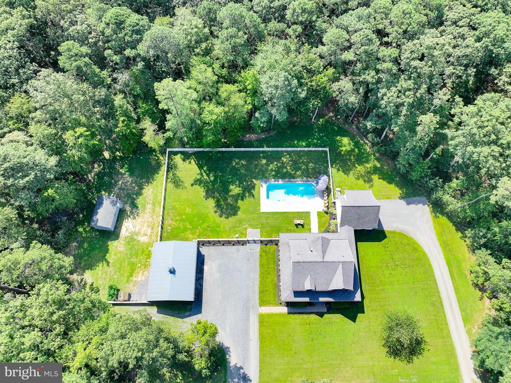 7841 Pea Neck Road St. Michaels, MD 21663 - Photo 3 of 41 an aerial view of a house with a garden swimming pool outdoor seating and yard