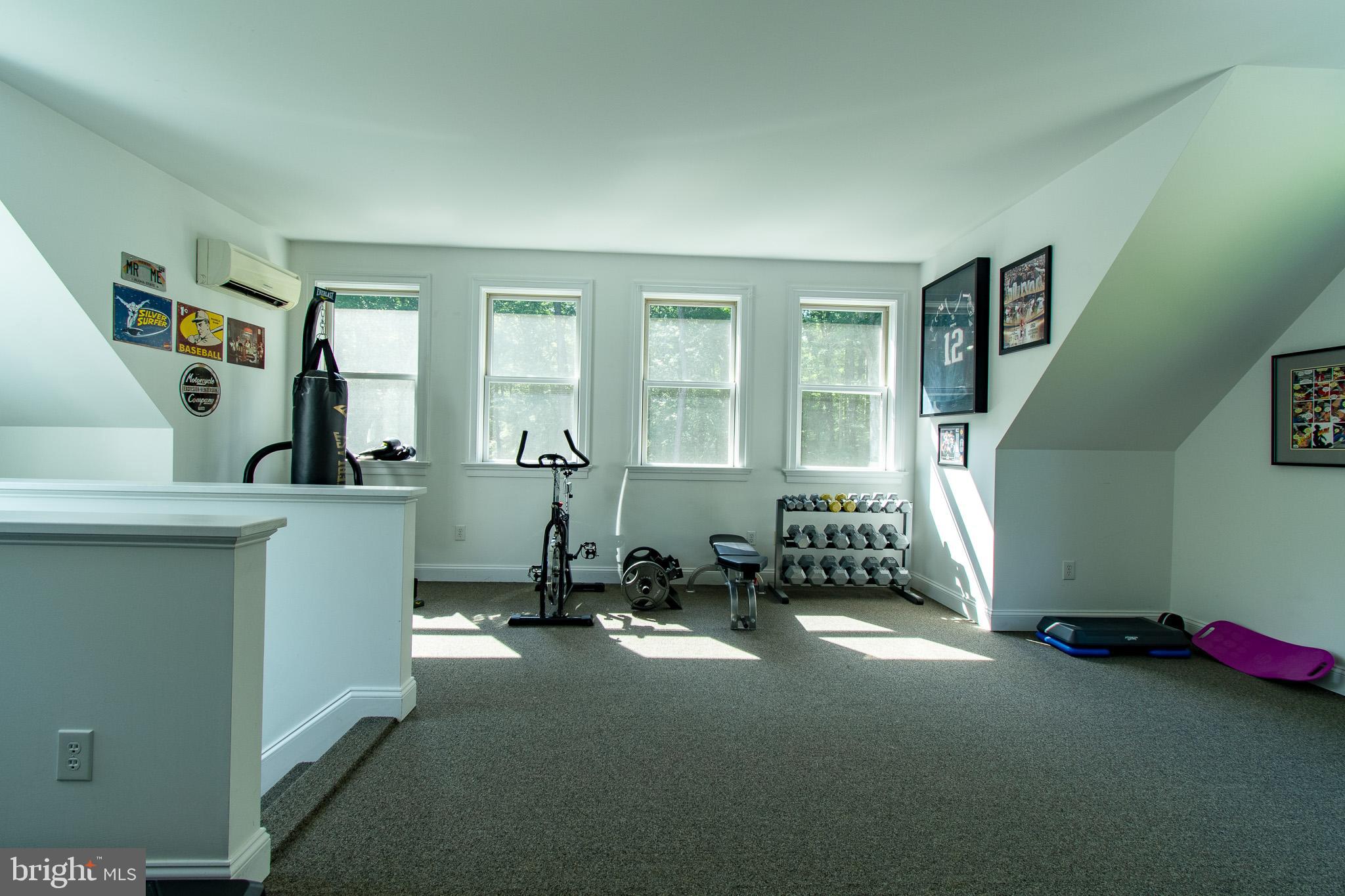 7841 Pea Neck Road St. Michaels, MD 21663 - Photo 33 of 41 a room with gym equipment and a large window