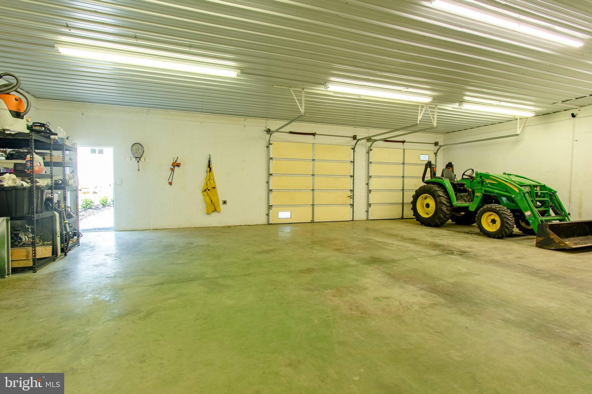 7841 Pea Neck Road St. Michaels, MD 21663 - Photo 38 of 41 a view of a garage with parked cars