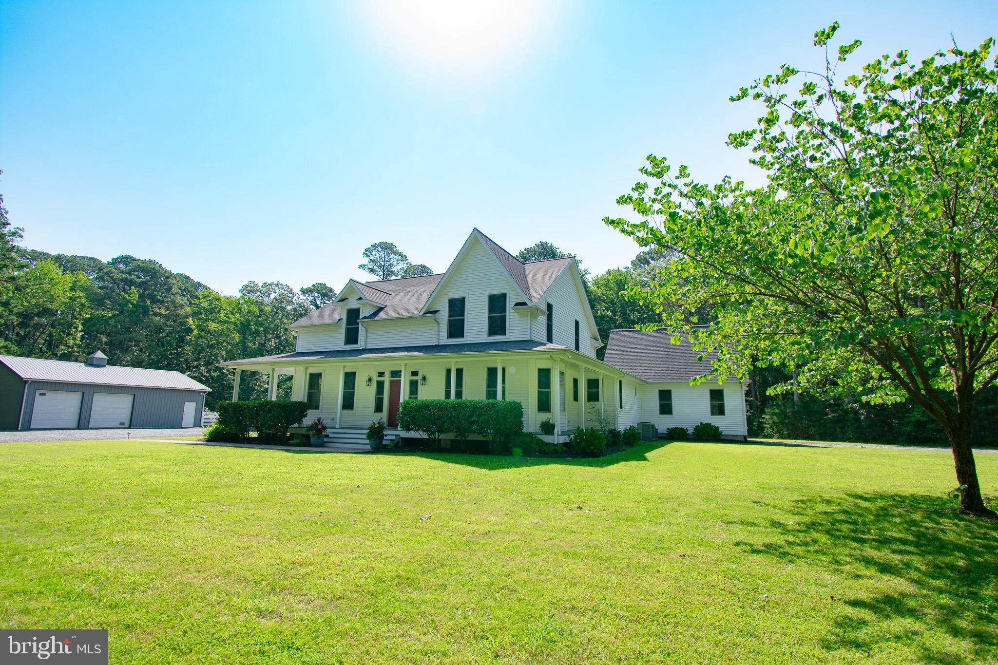 7841 Pea Neck Road St. Michaels, MD 21663 - Photo 5 of 41 a front view of house with yard and trees