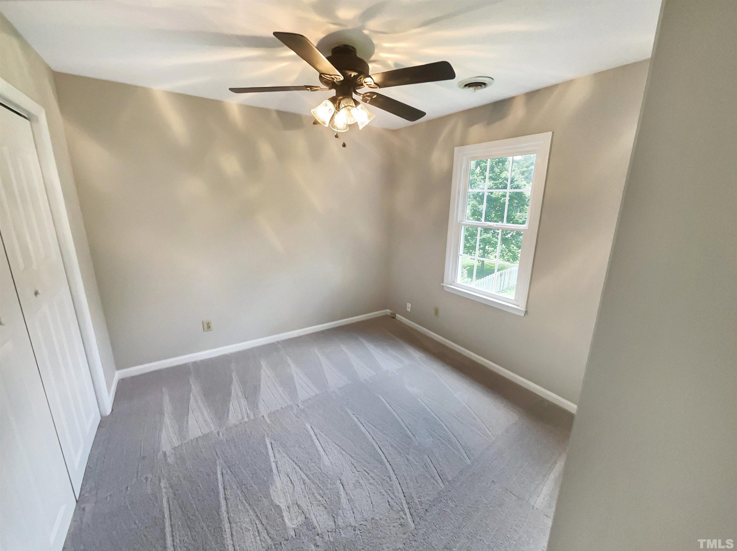 4521 Draper Road Raleigh, NC 27616 - Photo 15 of 17 wooden floor in an empty room with a window