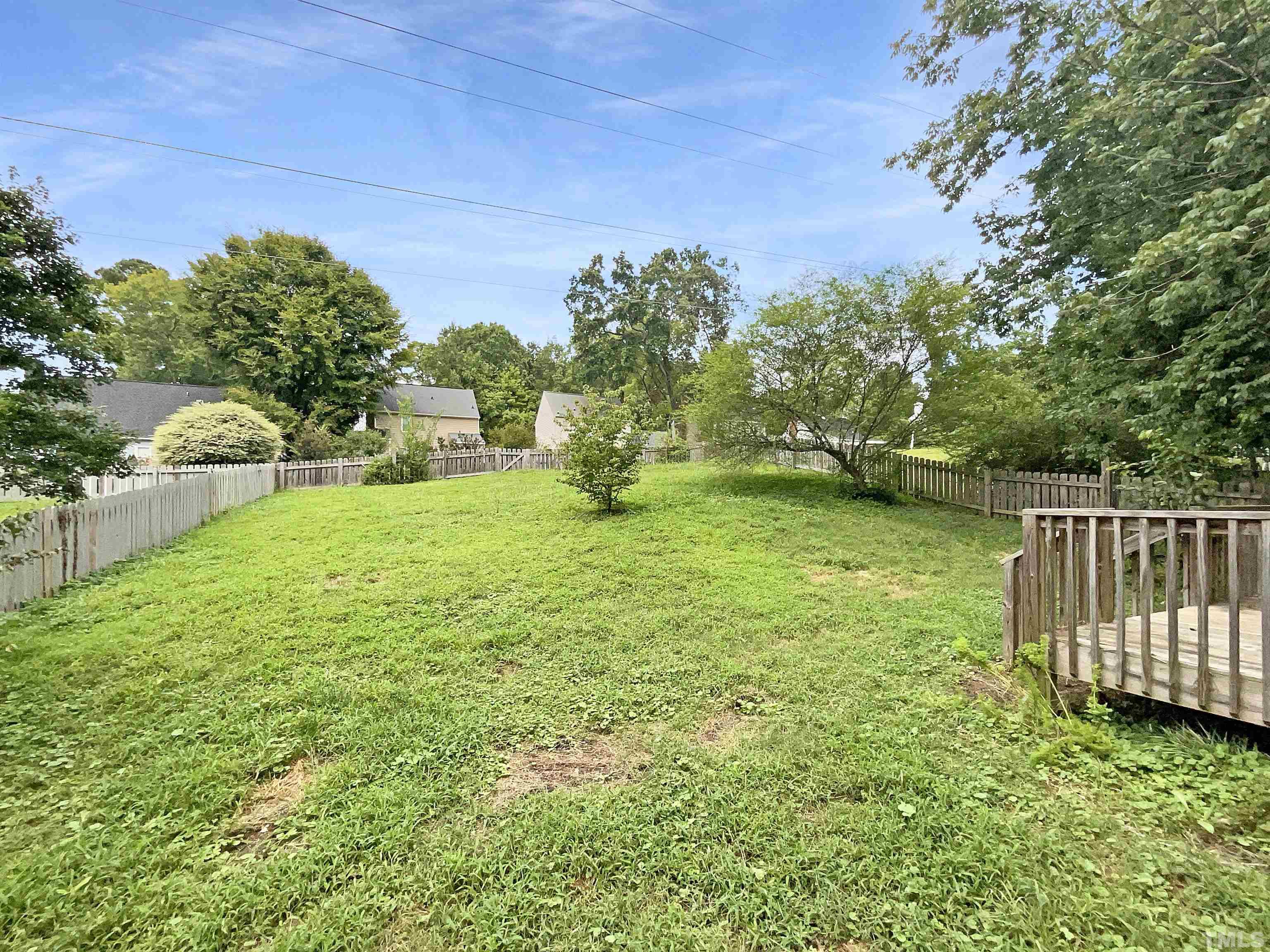 4521 Draper Road Raleigh, NC 27616 - Photo 17 of 17 a view of a garden with a tree