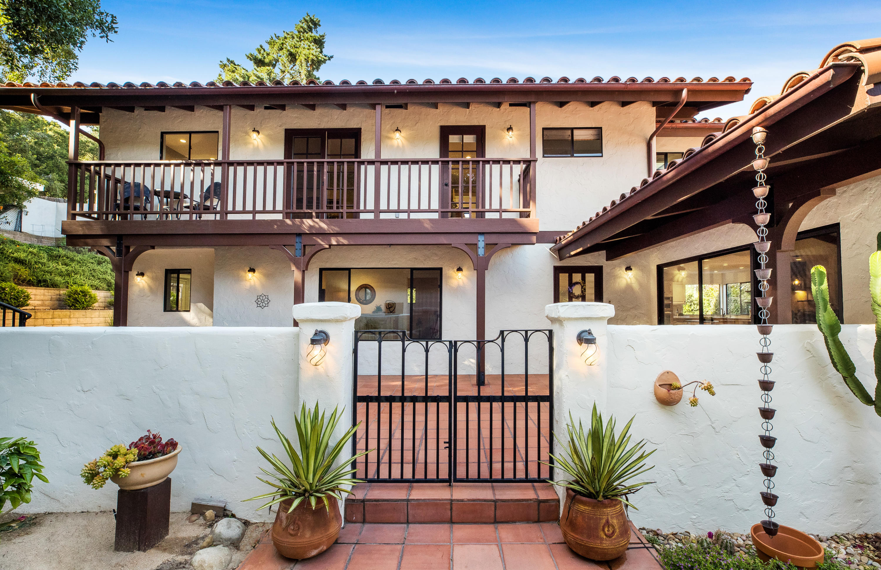 907 Fellowship Road Santa Barbara, CA 93109 - Photo 1 of 21 a view of a house with a wooden fence