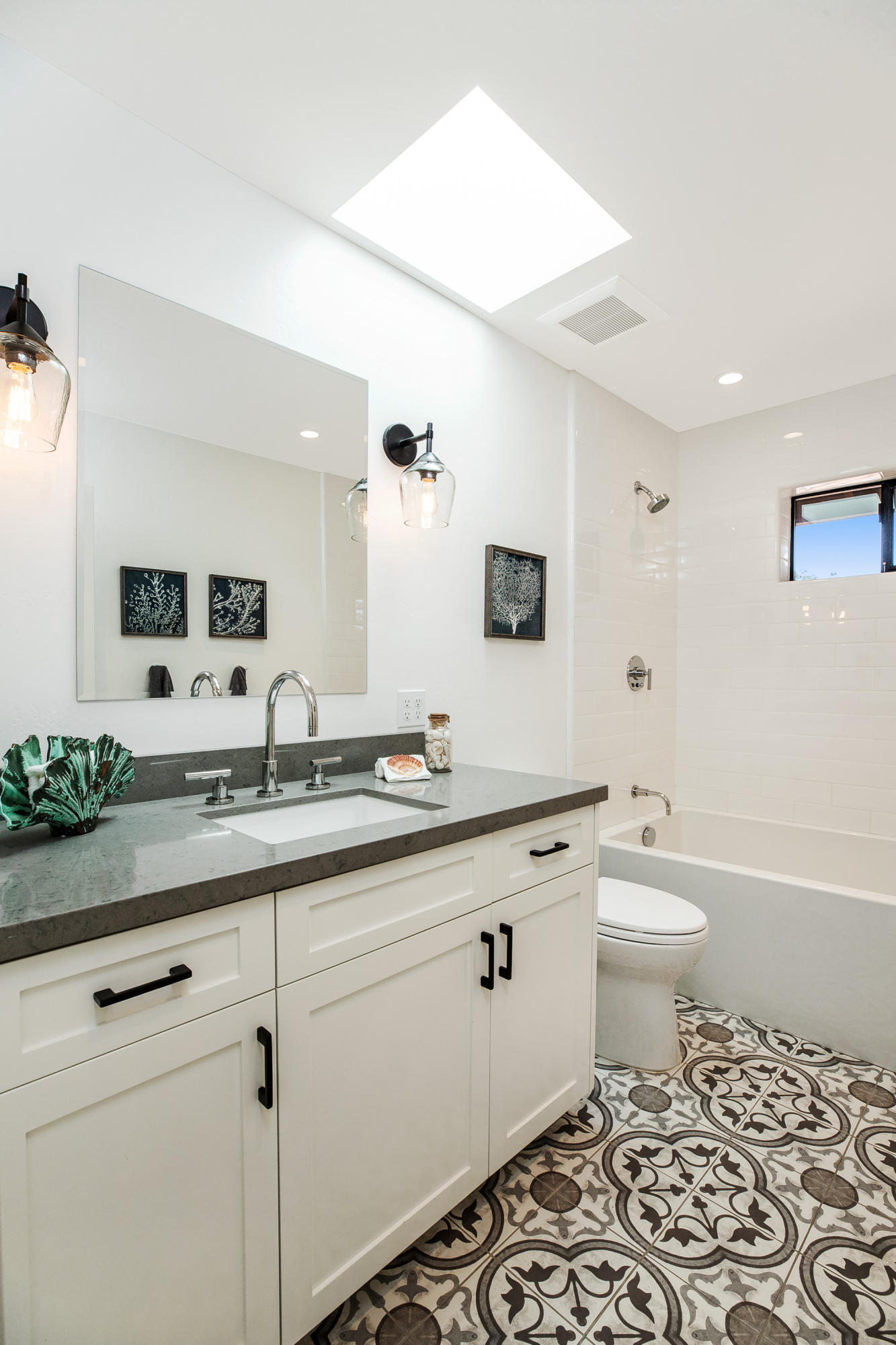 907 Fellowship Road Santa Barbara, CA 93109 - Photo 12 of 21 a bathroom with a double vanity sink mirror and toilet