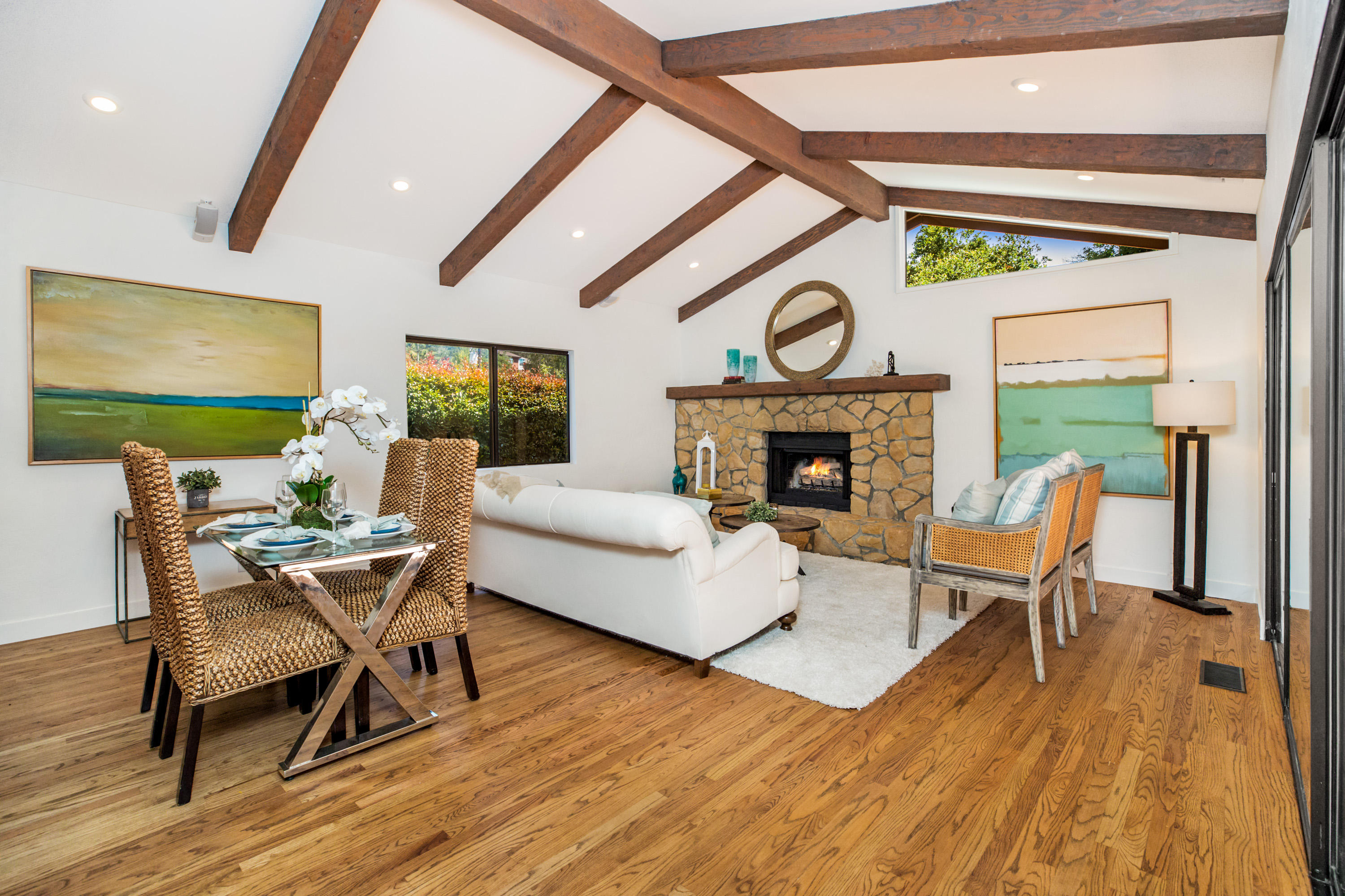 907 Fellowship Road Santa Barbara, CA 93109 - Photo 3 of 21 a living room with furniture a fireplace and a flat screen tv