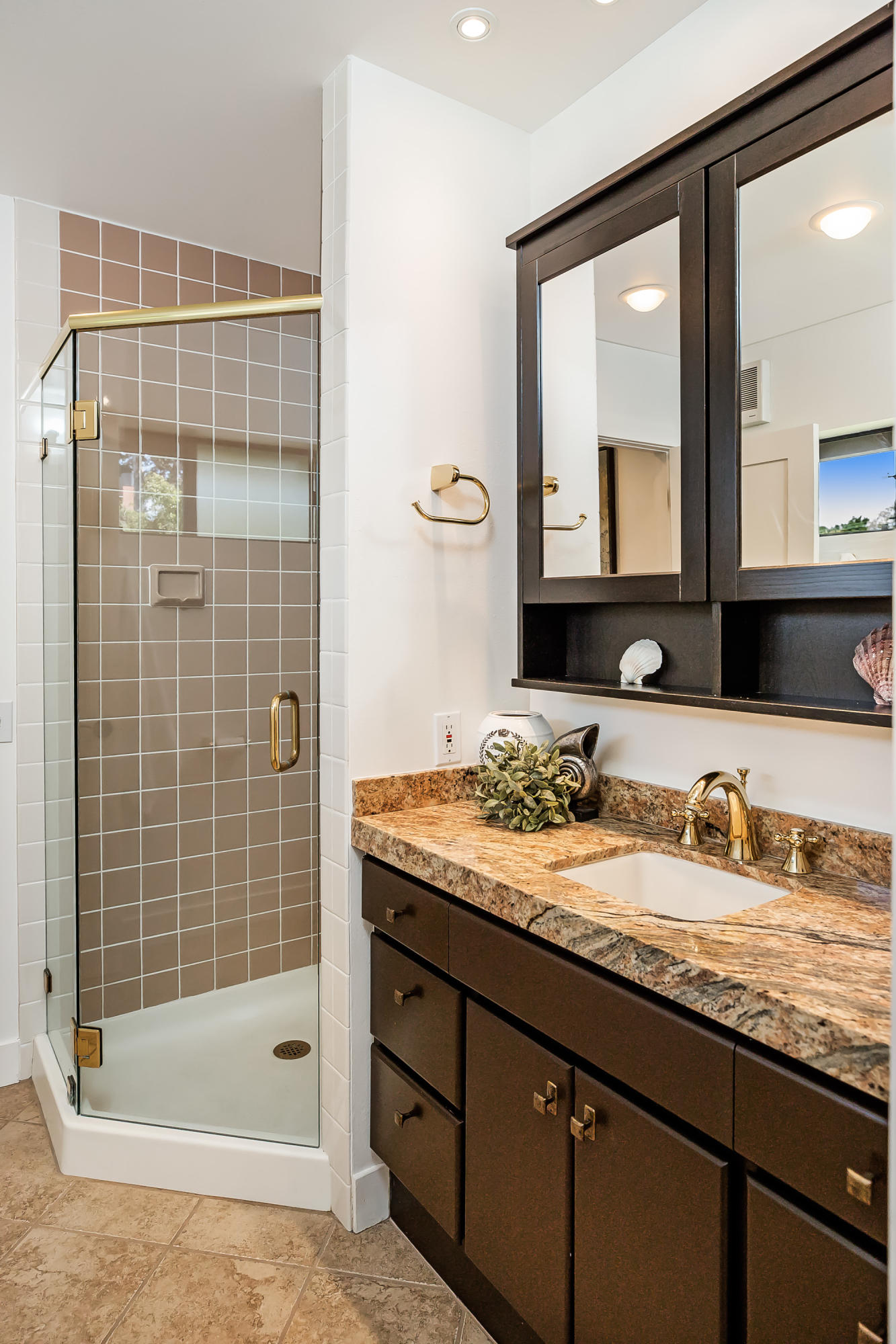 907 Fellowship Road Santa Barbara, CA 93109 - Photo 8 of 21 a bathroom with a granite countertop sink and a mirror