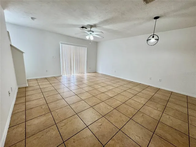 a view of a kitchen with wooden floor
