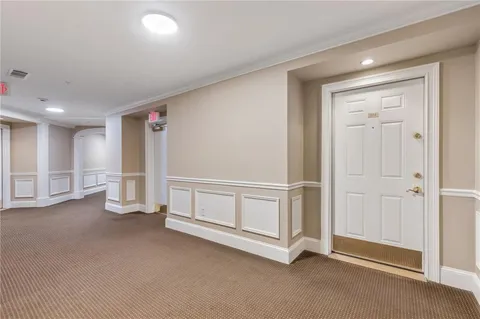 a kitchen with sink cabinets and dining table