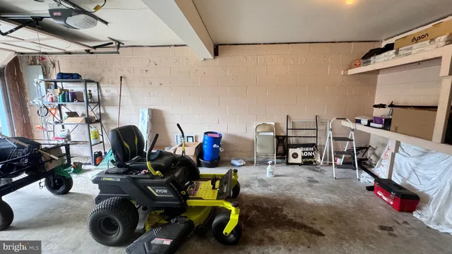 a view of empty field with trees in the background