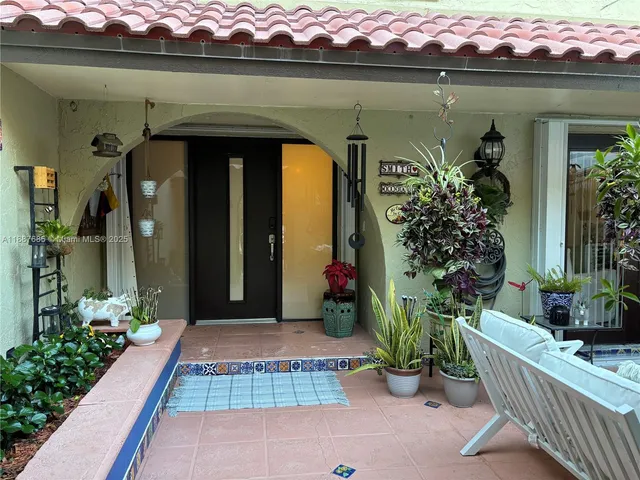 a kitchen with sink a stove and cabinets