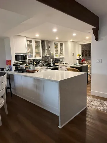 a kitchen with a sink and a stove