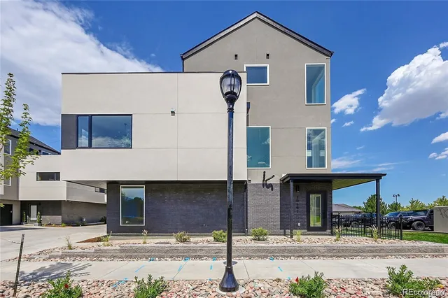 a front view of a house with garage