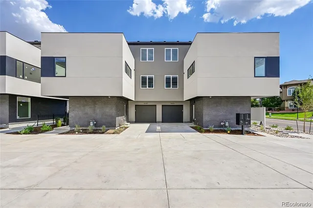 a view of a house with a flower garden