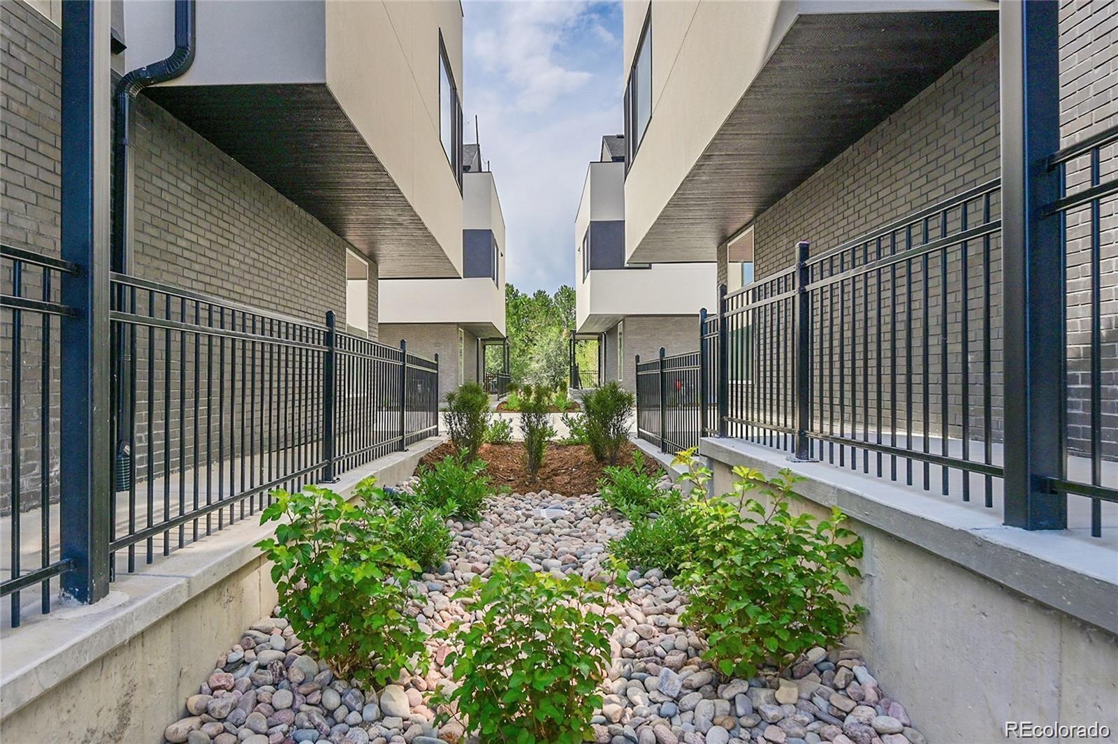 10187 West 38th Avenue Wheat Ridge, CO 80033 - Photo 28 of 50 a view of a house with a flower garden