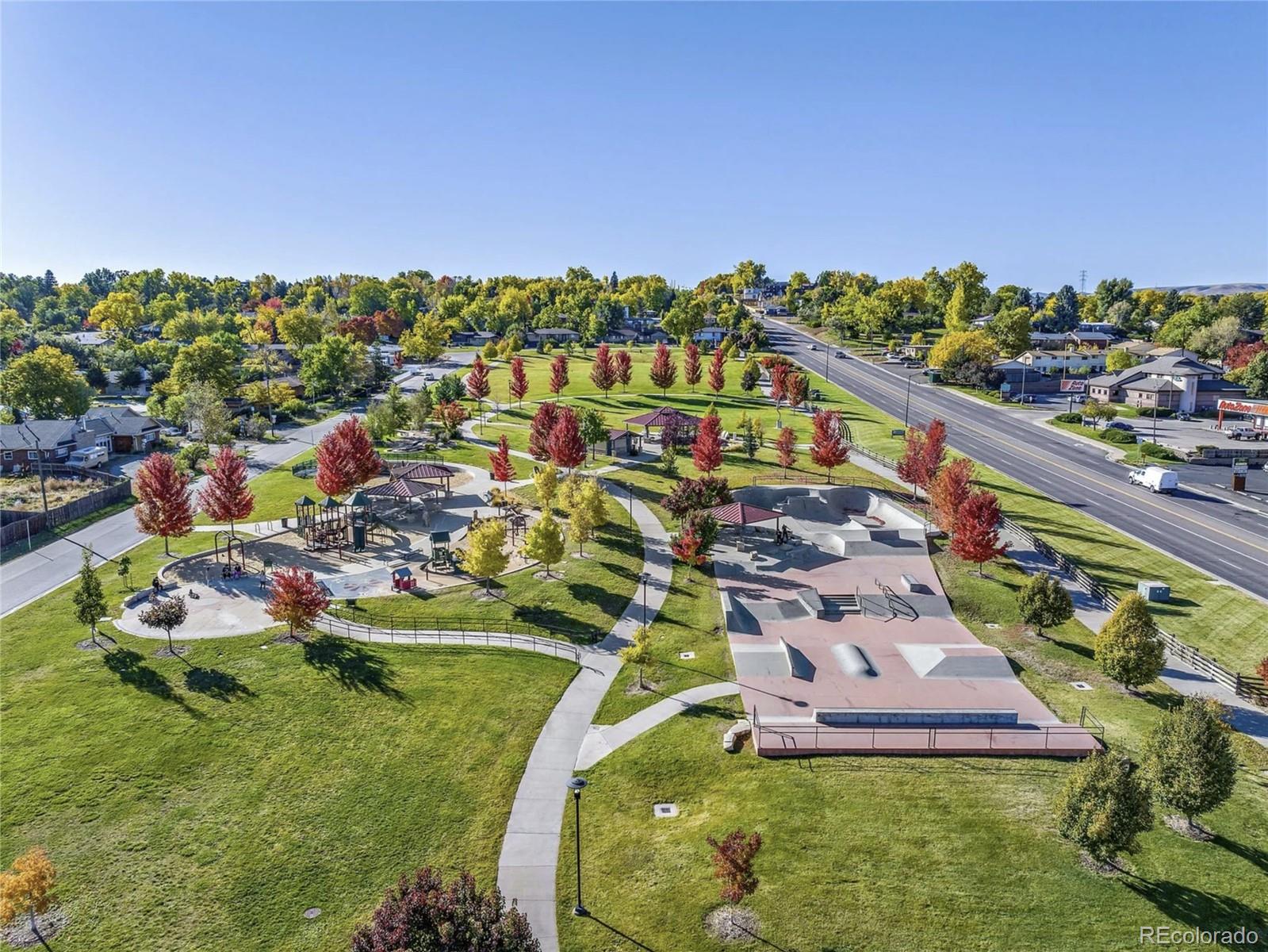 10187 West 38th Avenue Wheat Ridge, CO 80033 - Photo 39 of 50 an aerial view of a house with a garden and lake view