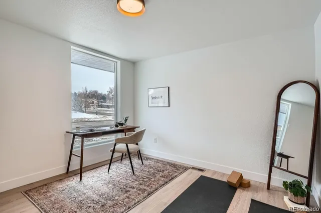 a work room with furniture and a window