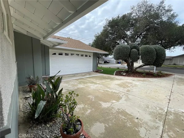 a house with garden in front of it