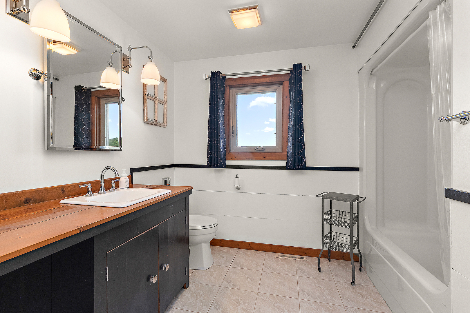 7860 West Steger Road Frankfort, IL 60423 - Photo 40 of 56 a bathroom with a sink and a mirror