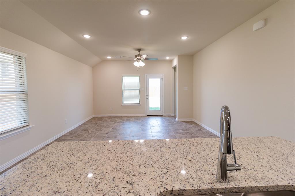 572 Ruthye Lane Pilot Point, TX 76258 - Photo 17 of 32 a view of a livingroom with a ceiling fan and window