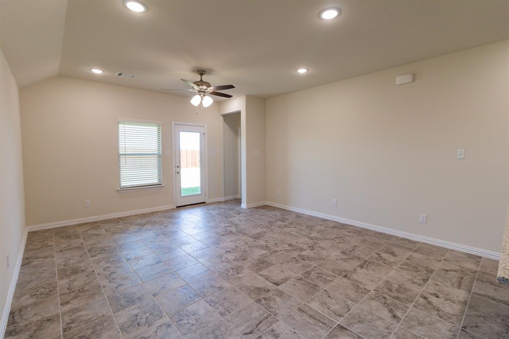 572 Ruthye Lane Pilot Point, TX 76258 - Photo 18 of 32 wooden floor in an empty room with a window