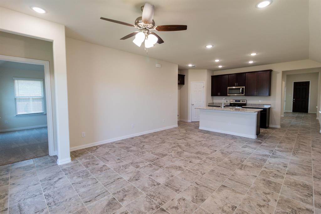 572 Ruthye Lane Pilot Point, TX 76258 - Photo 19 of 32 a view of kitchen with sink microwave and refrigerator