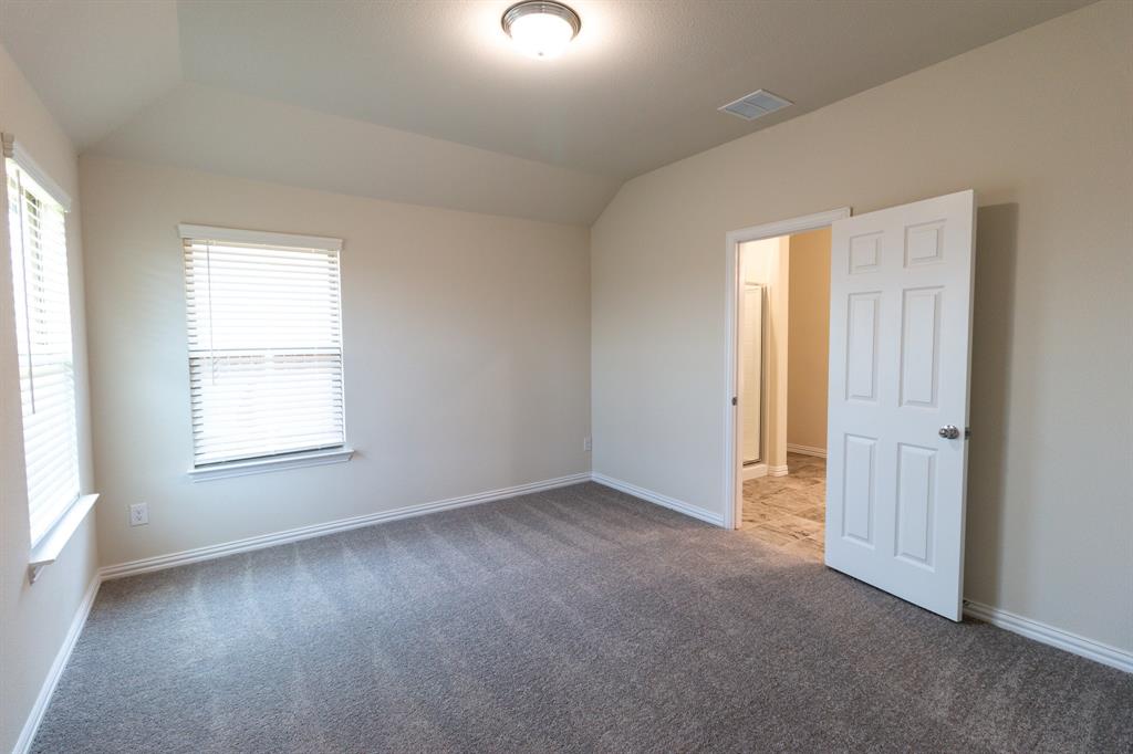 572 Ruthye Lane Pilot Point, TX 76258 - Photo 21 of 32 an empty room with windows and closet