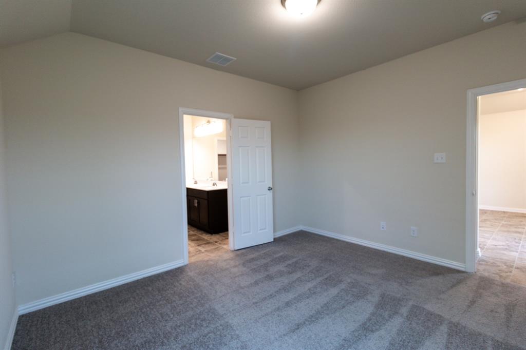 572 Ruthye Lane Pilot Point, TX 76258 - Photo 22 of 32 an empty room with windows