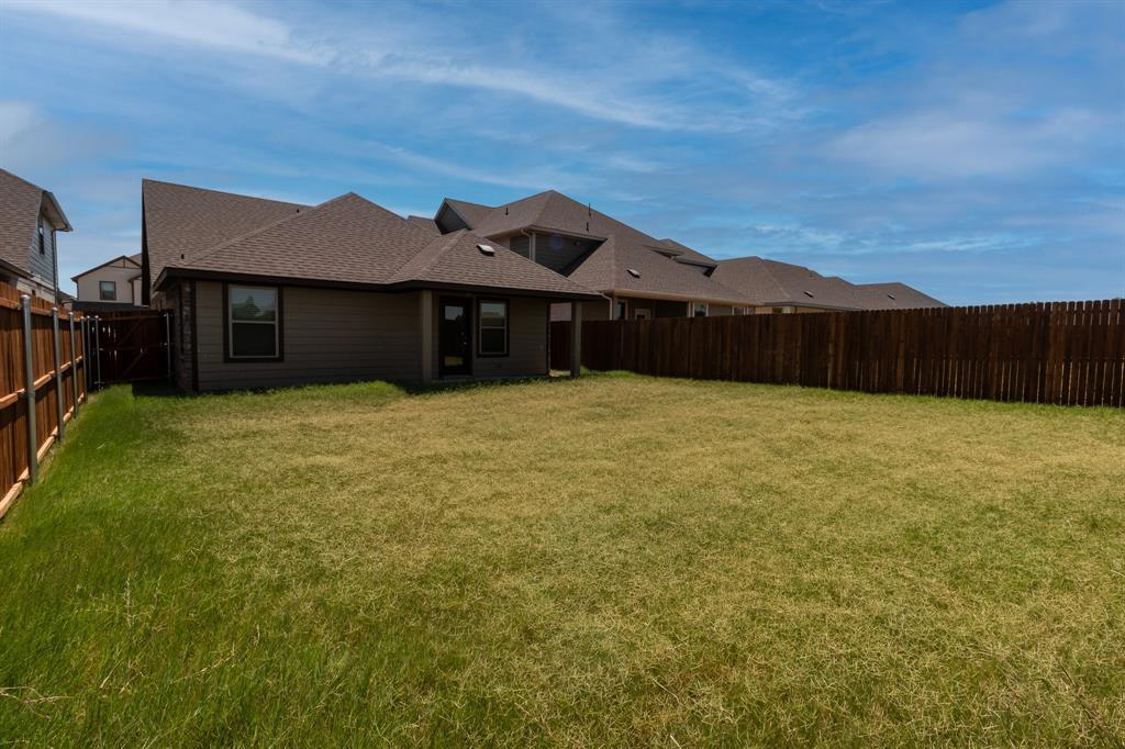 572 Ruthye Lane Pilot Point, TX 76258 - Photo 32 of 32 a large house with a big yard and large tree