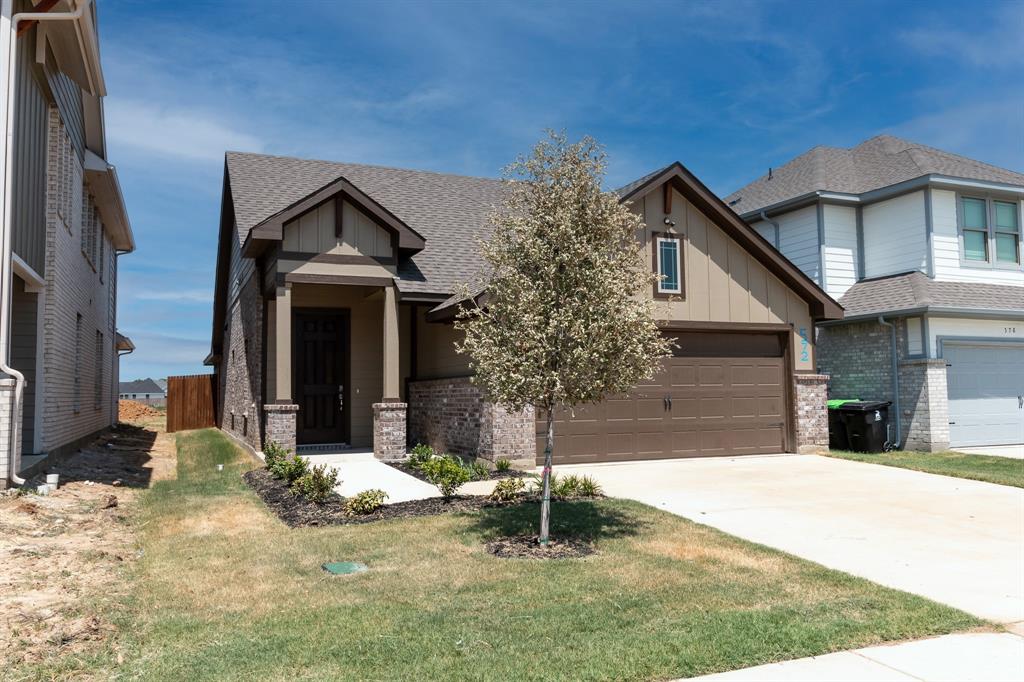 572 Ruthye Lane Pilot Point, TX 76258 - Photo 5 of 32 a front view of a house with a yard