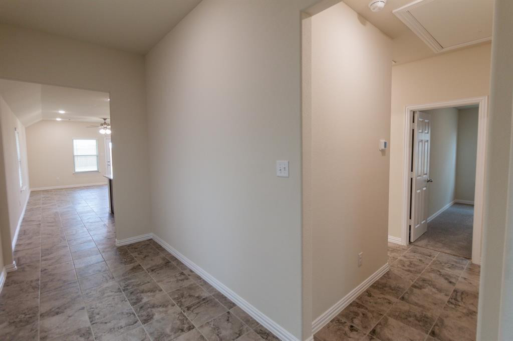 572 Ruthye Lane Pilot Point, TX 76258 - Photo 7 of 32 a view of hallway with wooden floor