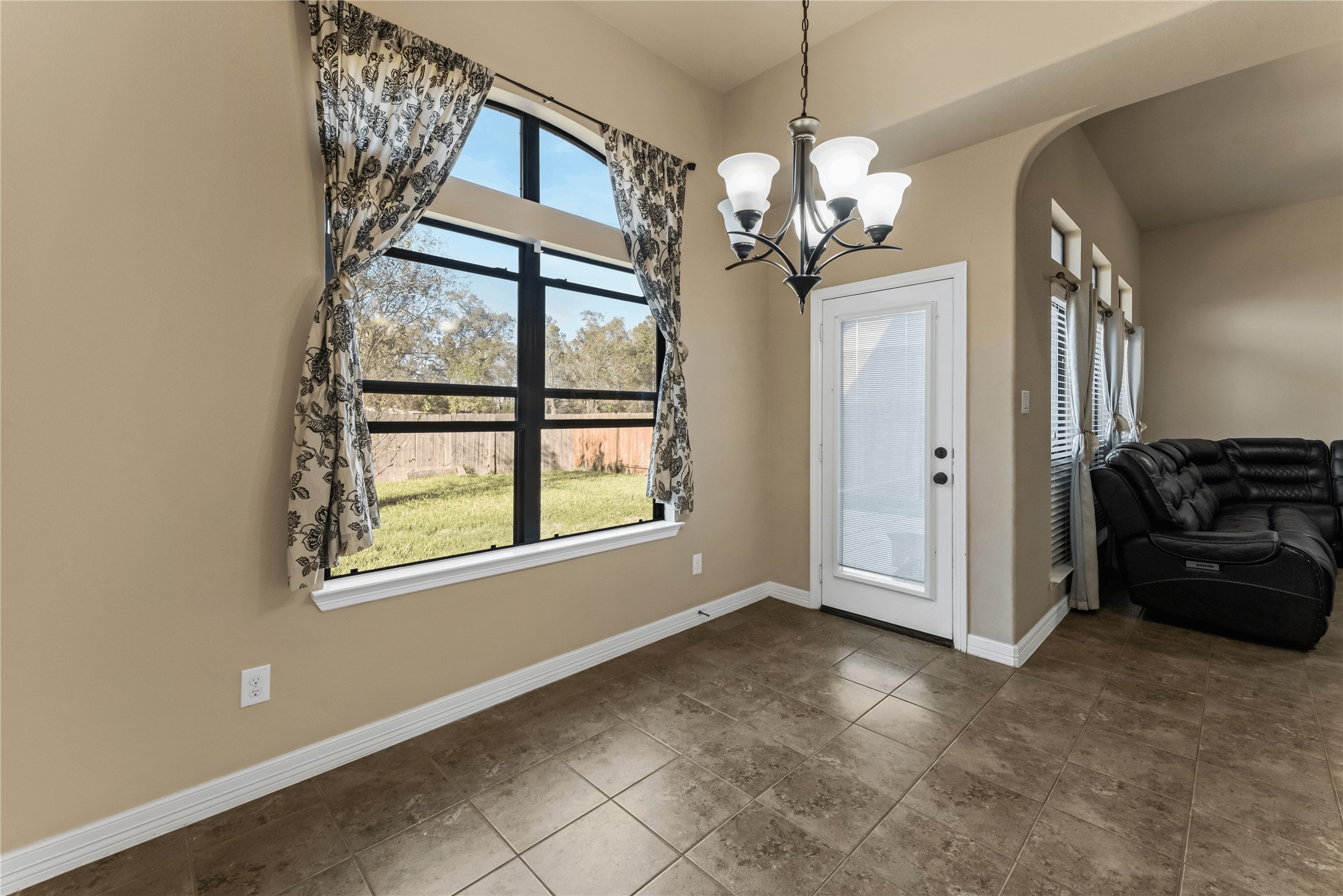 723 Audra Lane Spring, TX 77386 - Photo 16 of 35 a view of a livingroom with a chandelier furniture and windows