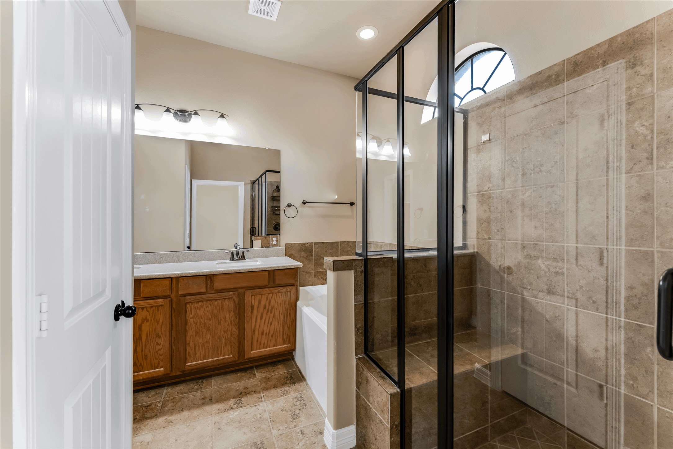 723 Audra Lane Spring, TX 77386 - Photo 22 of 35 a bathroom with a double vanity sink mirror and shower