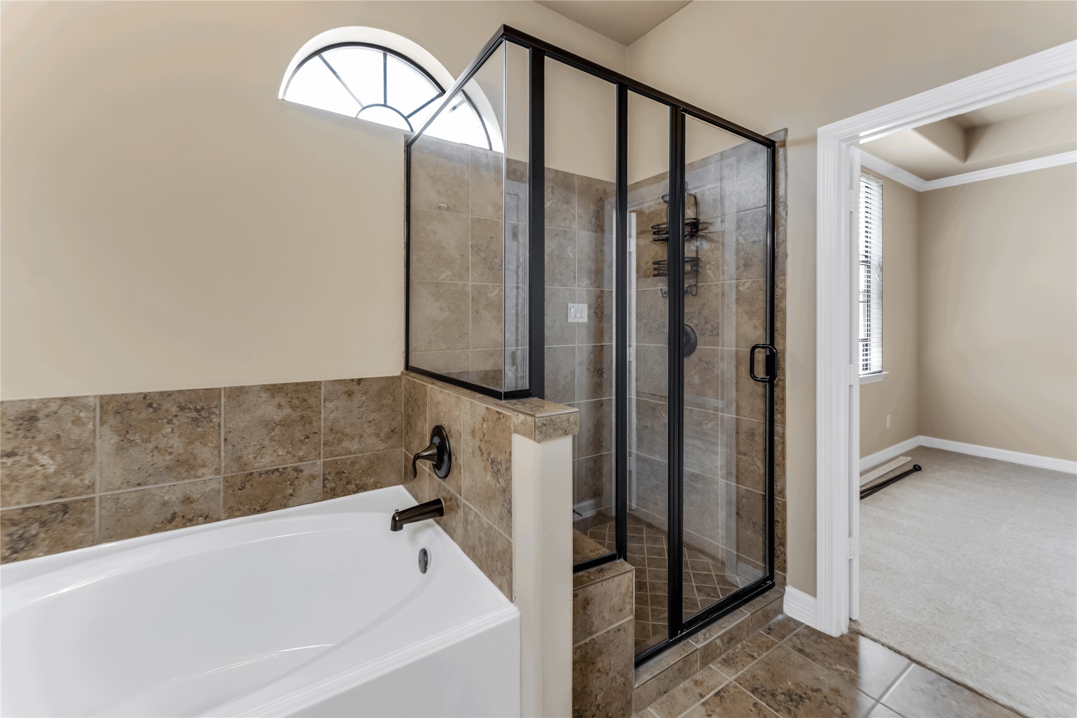 723 Audra Lane Spring, TX 77386 - Photo 23 of 35 a bathroom with a bathtub and a shower