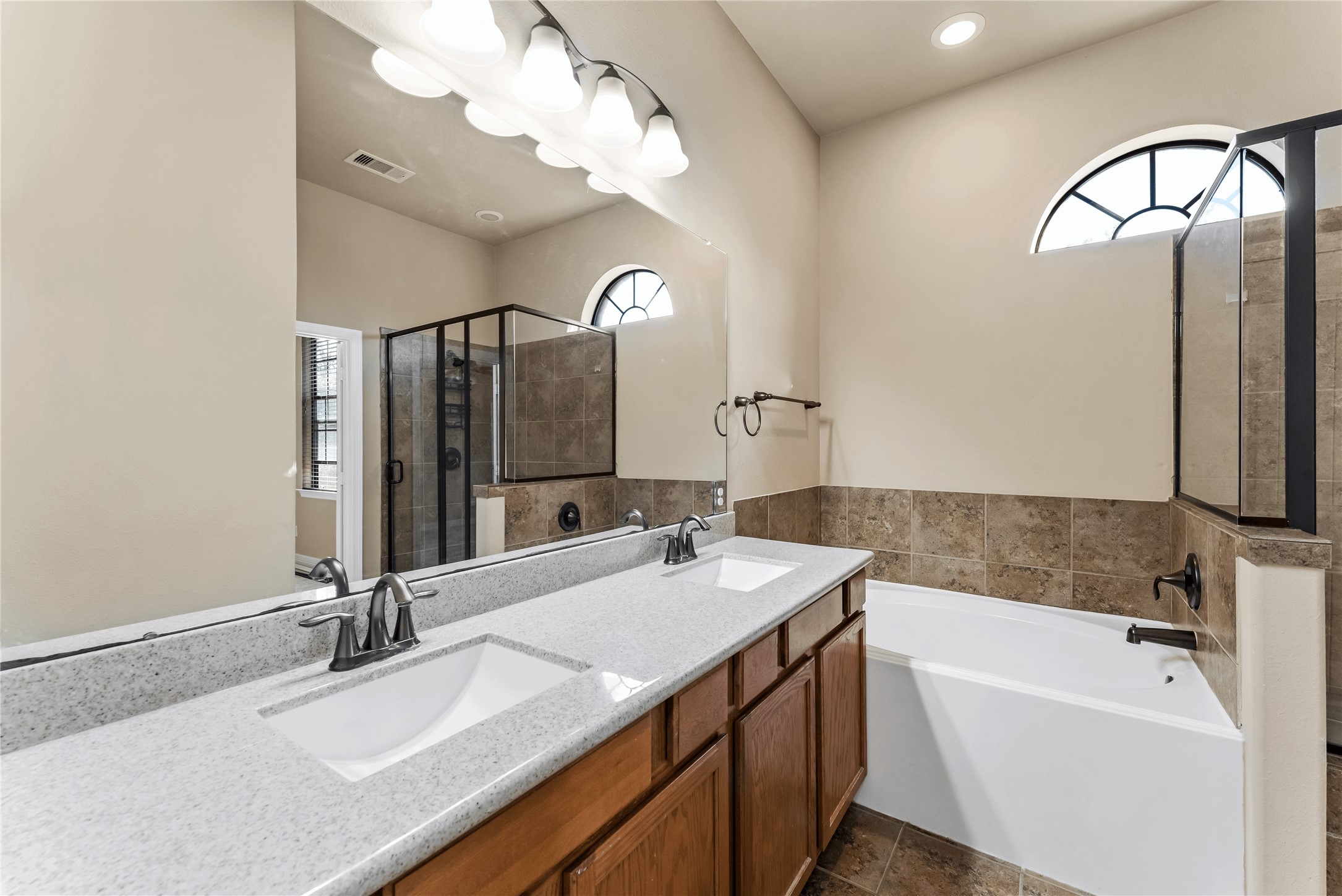 723 Audra Lane Spring, TX 77386 - Photo 24 of 35 a bathroom with a double vanity sink and a mirror