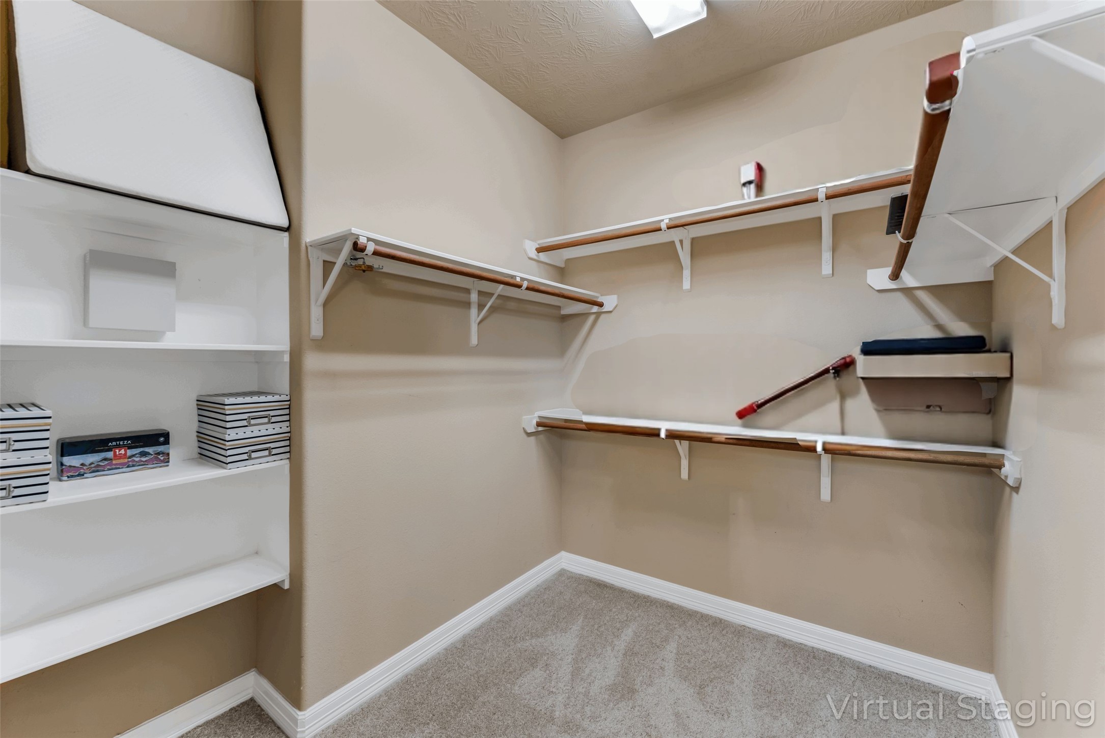 723 Audra Lane Spring, TX 77386 - Photo 25 of 35 a view of walk in closet with clothes and shoes