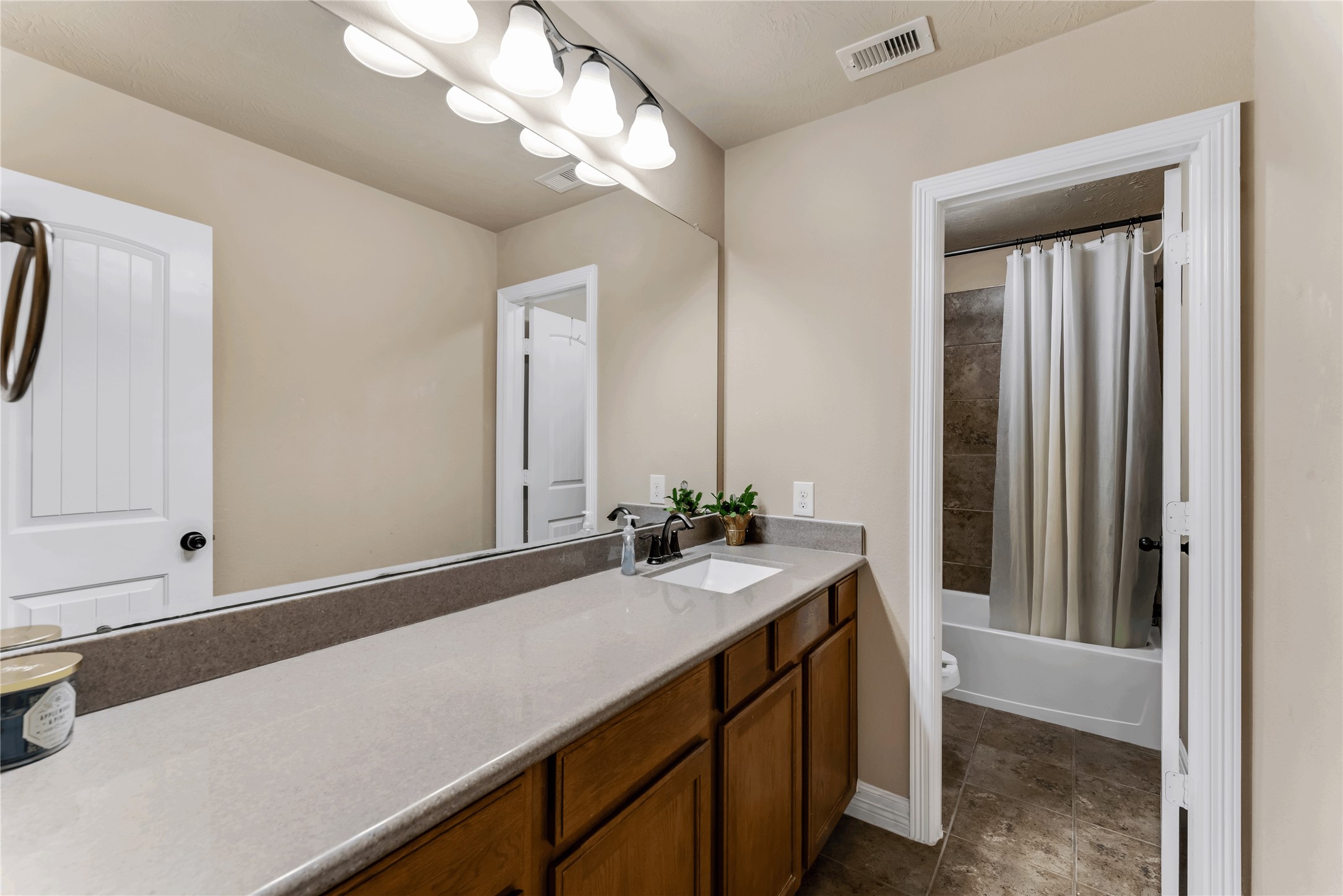 723 Audra Lane Spring, TX 77386 - Photo 28 of 35 a bathroom with a sink vanity and a mirror