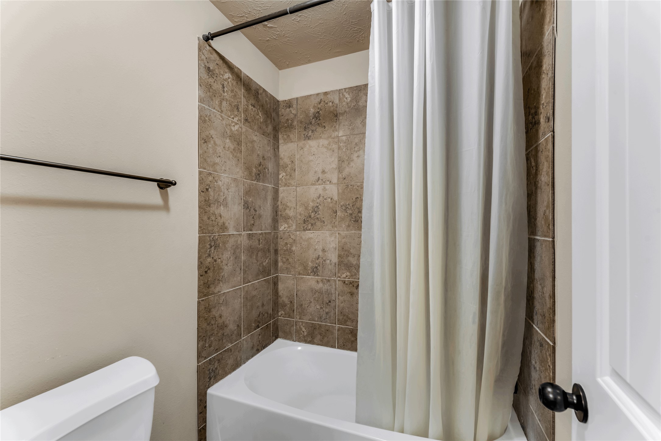 723 Audra Lane Spring, TX 77386 - Photo 29 of 35 a bathroom with a bathtub and a shower
