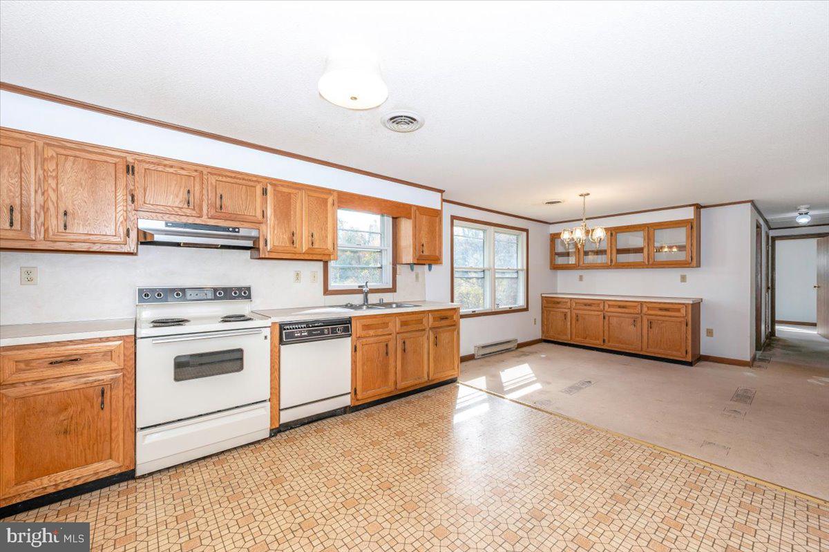 29007 Ridge Road Mount Airy, MD 21771 - Photo 12 of 50 a kitchen with stainless steel appliances granite countertop a stove and a sink