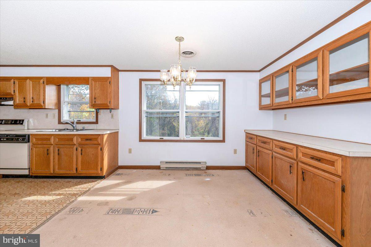 29007 Ridge Road Mount Airy, MD 21771 - Photo 14 of 50 a kitchen with stainless steel appliances granite countertop a stove a sink and a refrigerator
