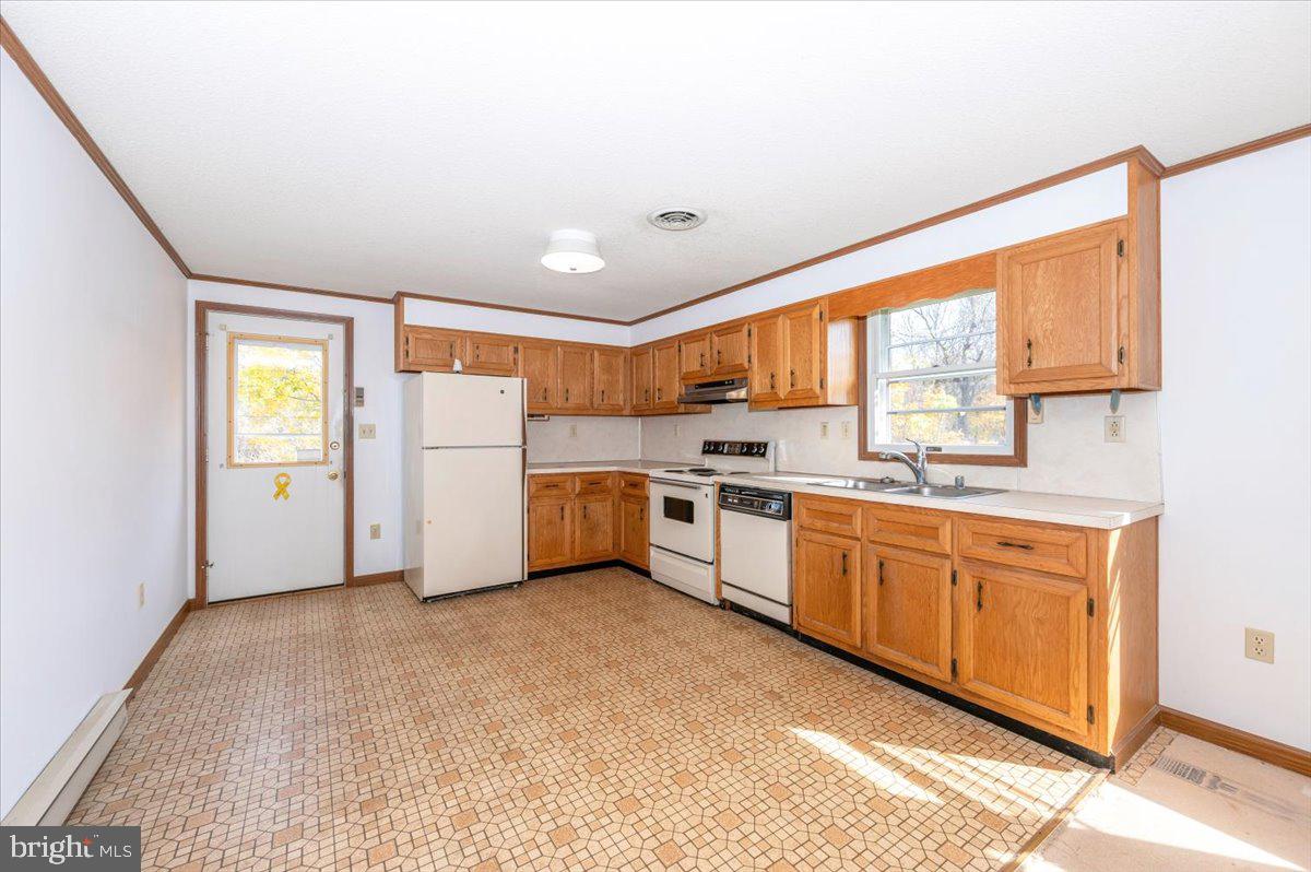 29007 Ridge Road Mount Airy, MD 21771 - Photo 15 of 50 a kitchen with stainless steel appliances granite countertop a refrigerator sink and cabinets