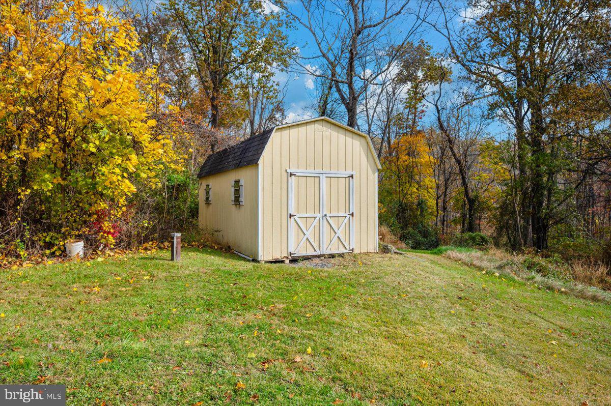 29007 Ridge Road Mount Airy, MD 21771 - Photo 50 of 50 a view of a backyard with a house and large trees