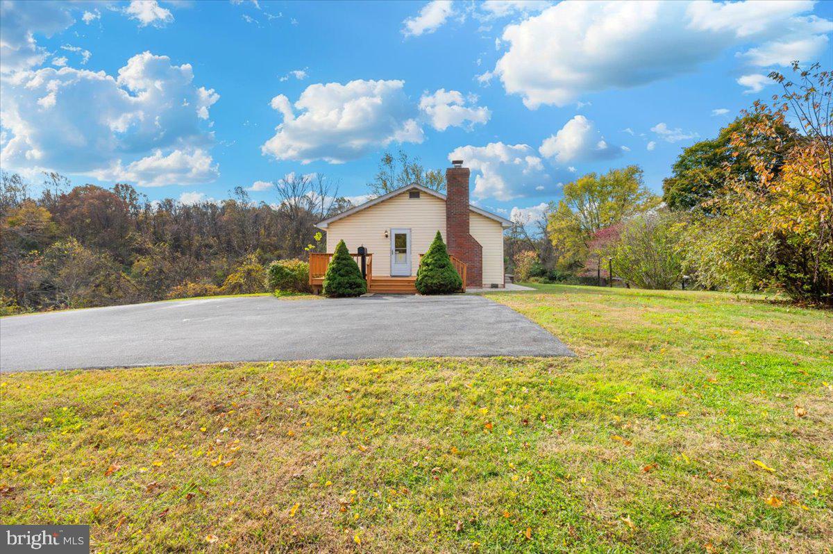 29007 Ridge Road Mount Airy, MD 21771 - Photo 6 of 50 a view of an white house with a yard