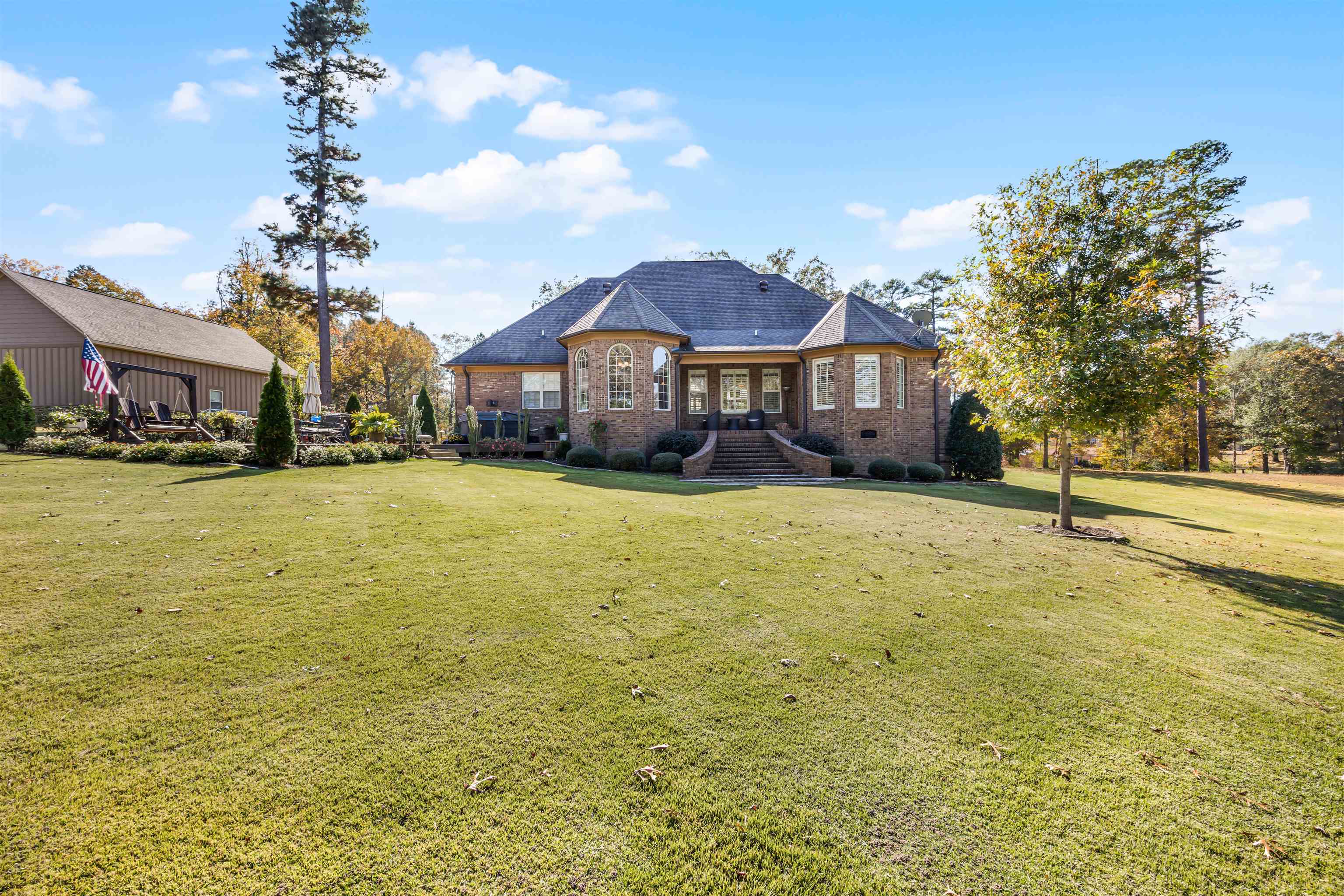 140 Legends Drive Counce, TN 38326 - Photo 27 of 30 Rear view of house featuring a lawn and brick siding