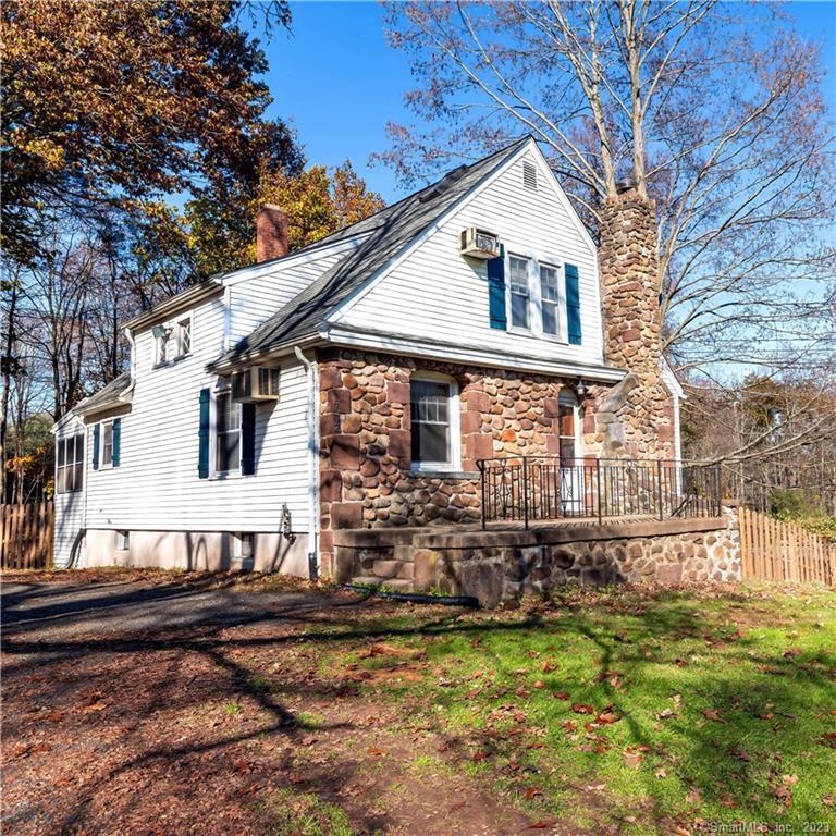 a front view of a house with yard