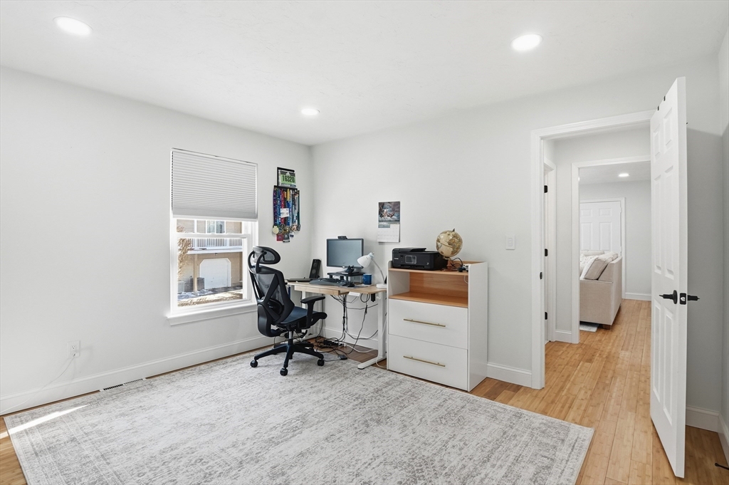 425 Main Street, Unit 21D Hudson, MA 01749 - Photo 11 of 21 a workspace with furniture and a window