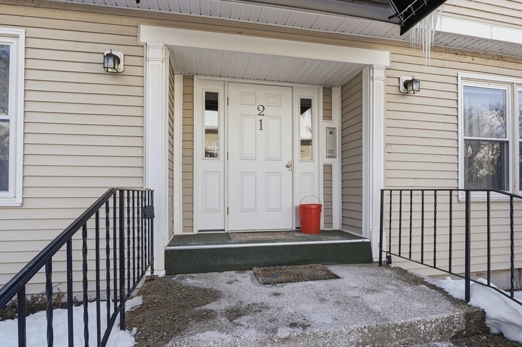 425 Main Street, Unit 21D Hudson, MA 01749 - Photo 2 of 21 a view of wooden house with a bench