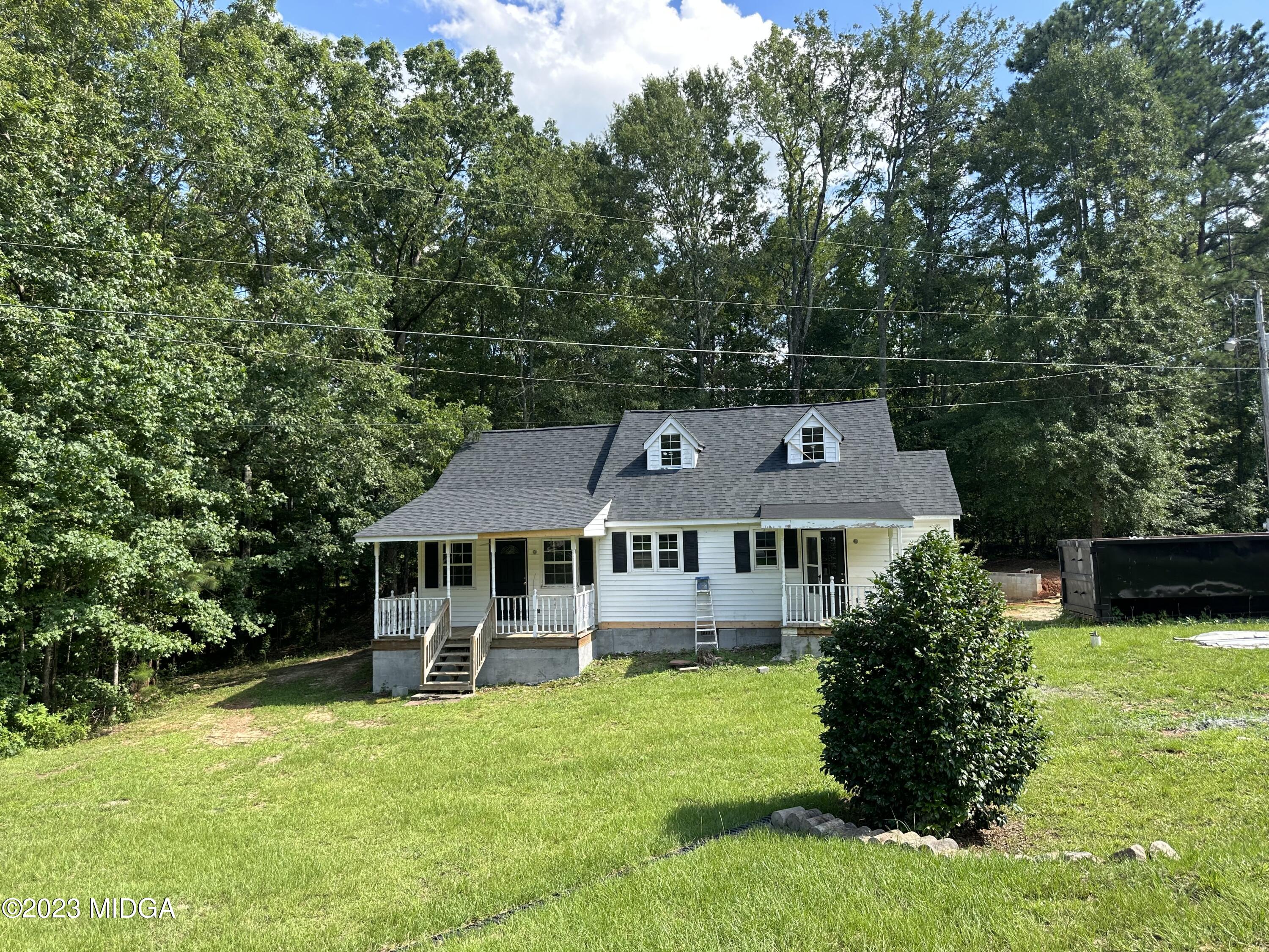 365 Taylor Road Juliette, GA 31046 - Photo 1 of 12 a aerial view of a house with a yard table and chairs