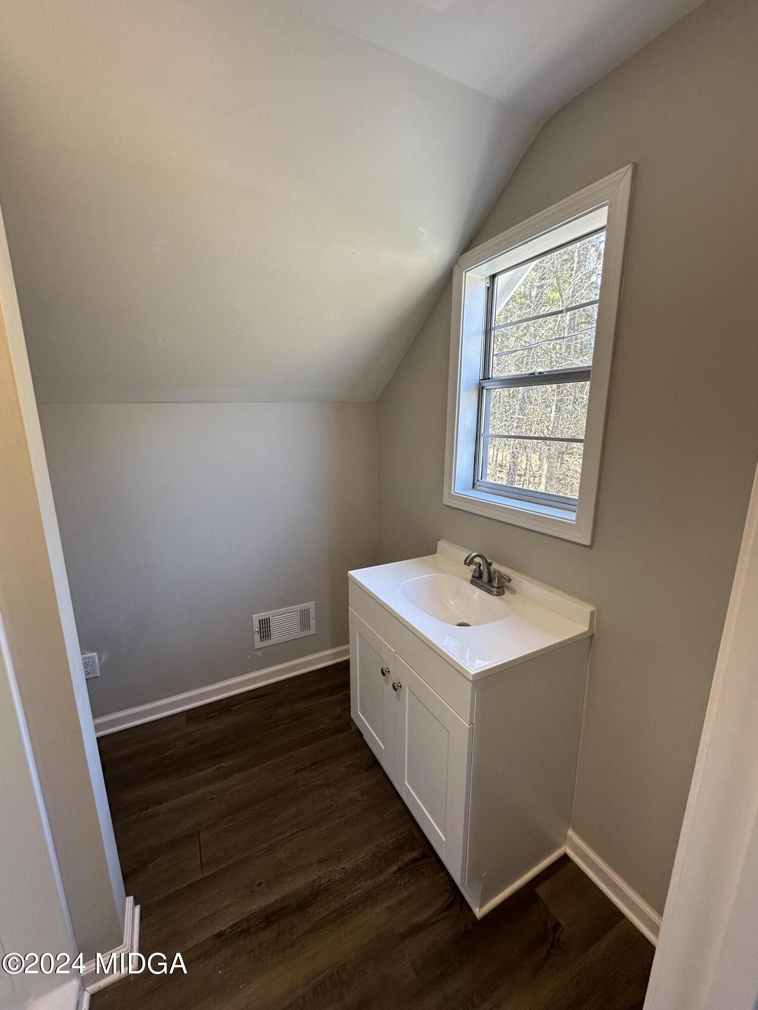 365 Taylor Road Juliette, GA 31046 - Photo 11 of 12 a bathroom with a sink and a window