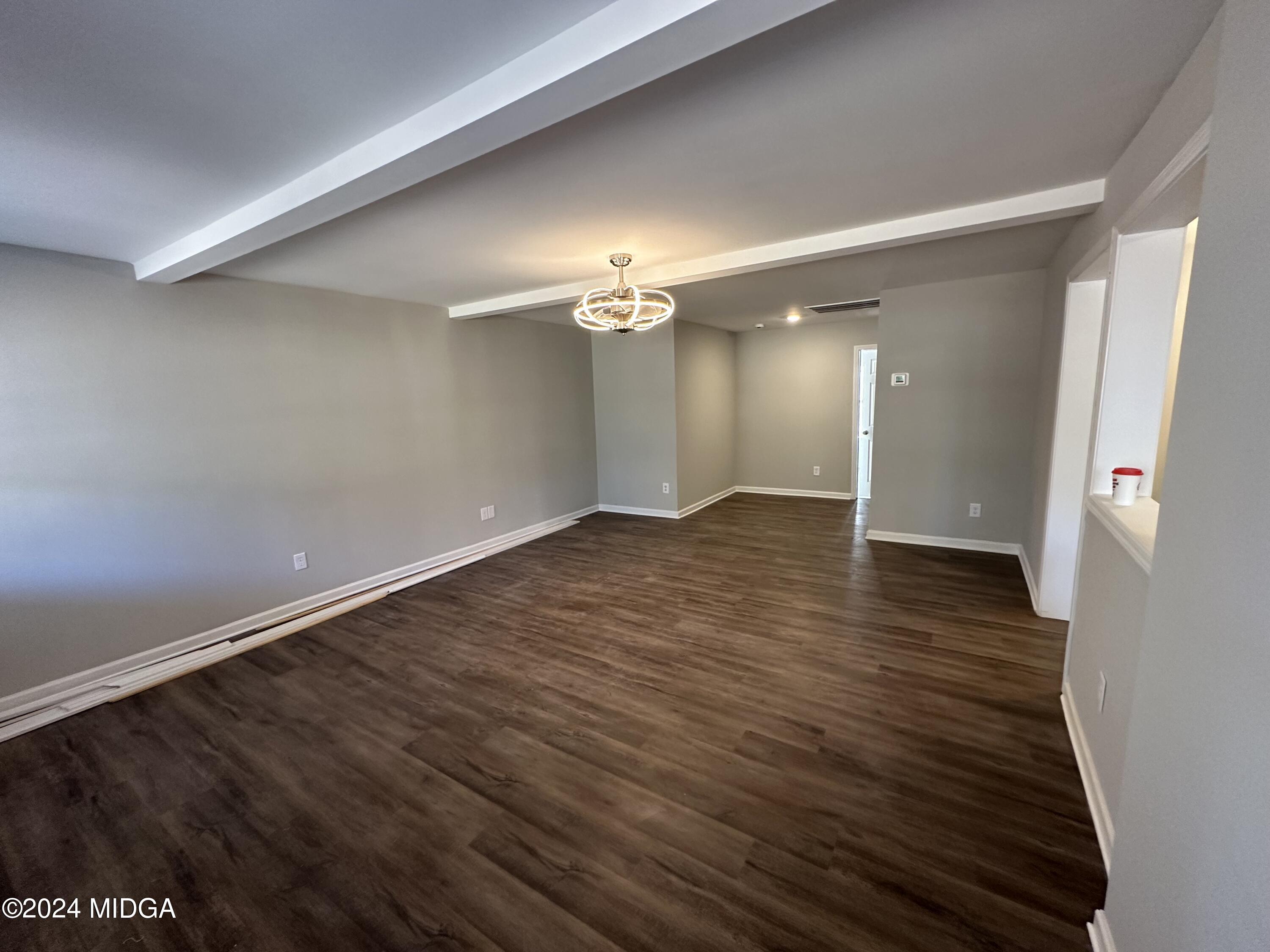 365 Taylor Road Juliette, GA 31046 - Photo 5 of 12 wooden floor in an empty room with a window