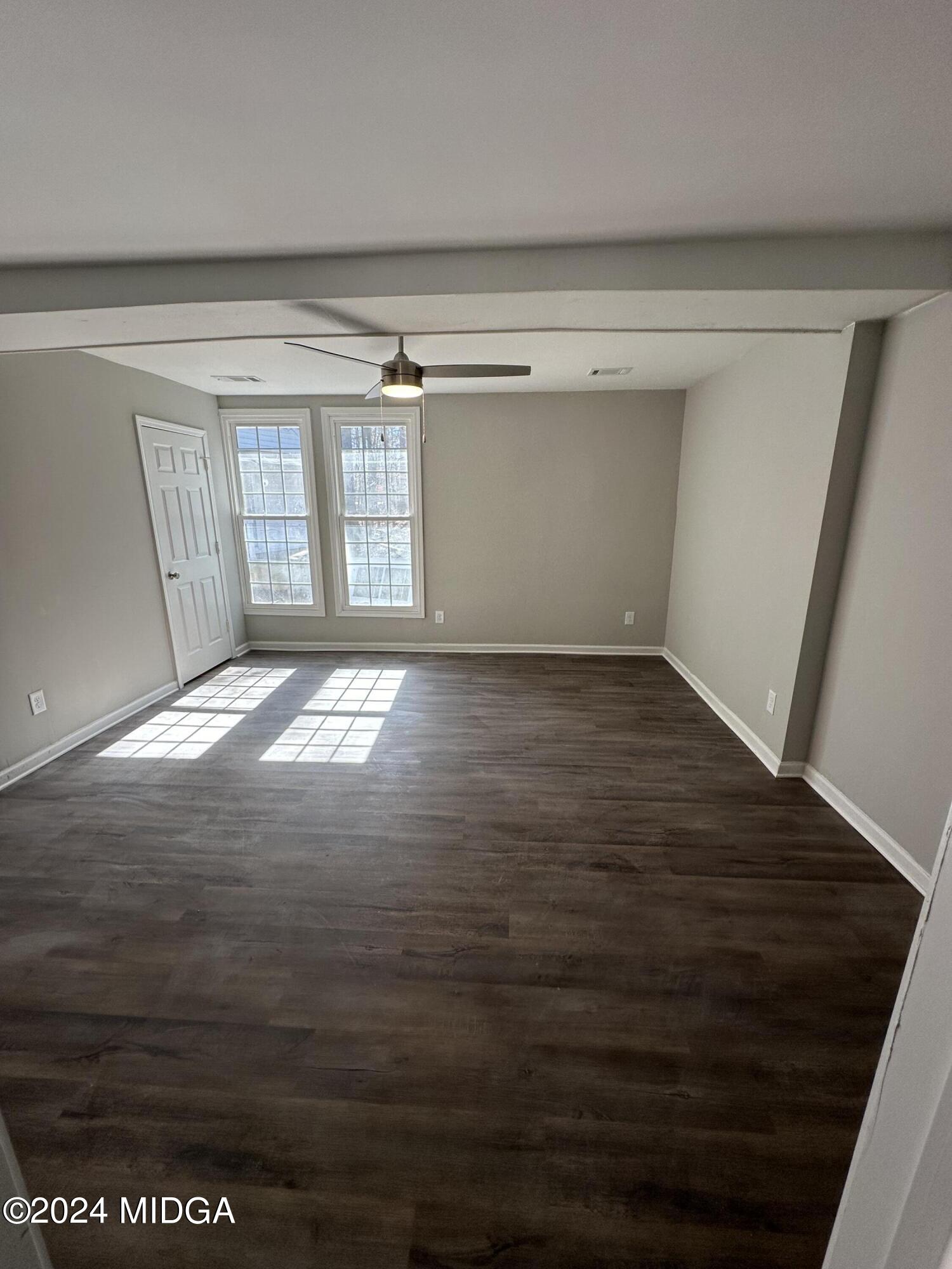 365 Taylor Road Juliette, GA 31046 - Photo 8 of 12 a view of empty room with wooden floor and fan